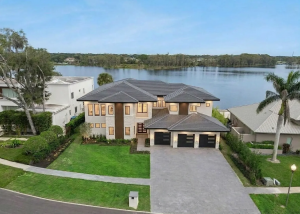 Modern two-story lakefront home at 9117 Bay Point Drive, Orlando, seen from above