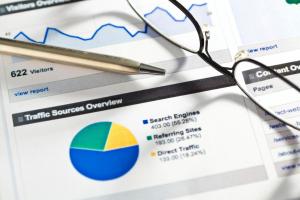 Printed website analytics documents highlighting search engine traffic data