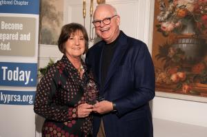 Nancy Wiser receiving award from Marc Whitt.