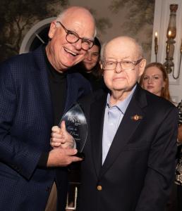 Marc Whitt handing Tom Preston a plaque