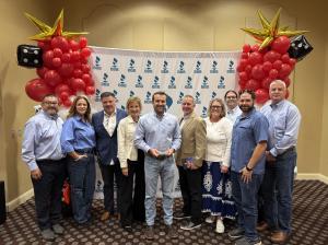 Design Tech Homes team members celebrating their 2026 BBB Pinnacle Award recognition at the Awards for Excellence ceremony in Houston.