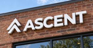 Photo of Ascent signage on a brick building.