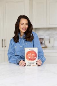 Gabriella Pomare displaying her new book, Before It Breaks, with pre-sales commencing November 2026.