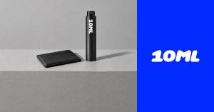 Black 10ML perfume travel atomiser beside a black leather card holder on a grey stone ledge, next to the white 10ML wordmark on an electric-blue panel