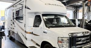 Class C RV parked in a service bay at Mango Automotive & Diesel in Yuma, Arizona