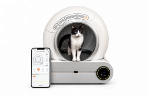 LitterLux self-cleaning litter box with a cat inside and the Tuya Smart app on a phone