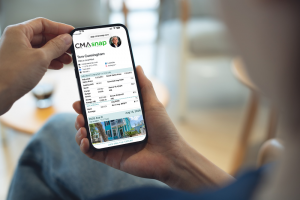 Mobile phone displaying the CMAsnap app interface, showing real estate comparative market analysis tools.