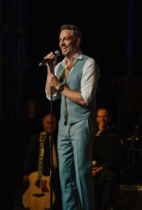 Zachary Levi on stage talking to the crowd during the Music is Medicine benefit concert.