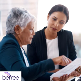 Accounting professional discussing financial documents with a client