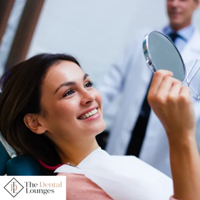 Patient looking at her smile during a dental appointment