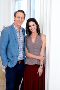 Relationship experts Mark Howerton, LMFT, and certified relationship coach Anna Howerton, creators of the Year One relationship course, standing together and smiling in a bright, sunlit room.