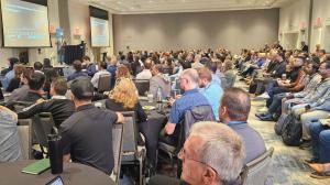 A full conference room of attendees at the 2025 AI Rising Conference
