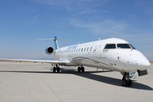GoJet Airlines Bombardier CRJ-550 aircraft in United Express livery parked on an airport ramp, featuring its premium regional jet design.
