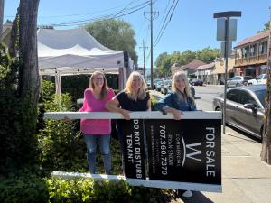 Sojourn Cellars staff Sherrie Perkovich, Fran Leach and Megan Loftus enjoy removal of the for sale sign in Sonoma..