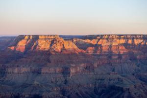 The sun shining directly on the canyon as it sets