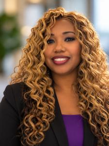 Professional headshot of Asha Aziza Peterson, Founder and Chief Executive Officer of Collaborative Shared Technologies LLC®, a Service-Disabled Veteran-Owned, Woman-Owned, and Minority-Owned professional services and consulting firm.