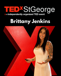 Brittany Jenkins on stage at TEDxStGeorge in front of the red TEDx X