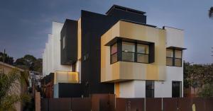A stylish house with a modern design, highlighted by bold yellow and black color accents.