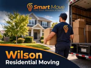 Professional movers carrying boxes and household belongings during a residential move in Wilson, North Carolina.