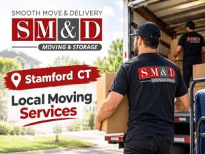 Professional movers unloading cardboard boxes from a moving truck during a residential relocation.