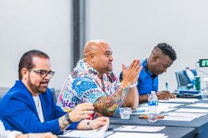 Elijah Desmond seated at the Dentistry's Got Talent judges' table in Miami with Dr. Anthony Vocaturo and Morris Mugo