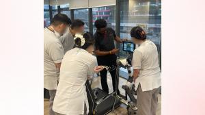 Robotimize team member guiding rehabilitation team on the RevitaVivante ProMax
