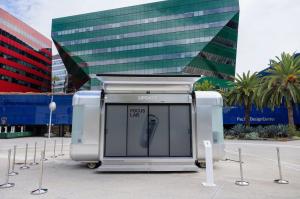 Silver Nomad Luxe Walk-In L mobile pop-up shop branded as UPDATE's touring Focus Lab, with its canopy raised, outside the Pacific Design Center in West Hollywood