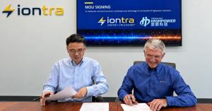 Representatives of Iontra and Highpower signing the MOU at a table, with both company logos on screen behind them