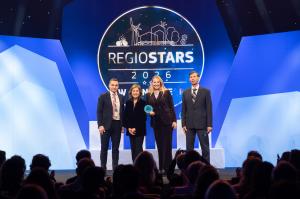 Maria Vircikova and Matus Durkac of MATSUKO accept the REGIOSTARS 2026 Award for AI Holopresence, developed with Pavol Jozef Šafárik University in Košice. Brussels, 14 October 2026.