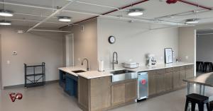 Community kitchen with two sinks plumbed by Fox Valley Plumbing & Backflow on the renovated fourth floor of Lindner Tower at Judson University in Elgin, Illinois