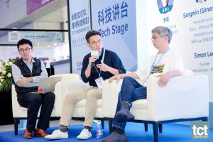Three panelists seated on stage at TCT Shenzhen 2026, with AMPulse founder Sangmin Lee speaking at the center.