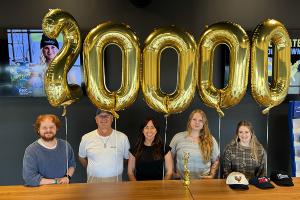 The Make My Cap team in Cape Girardeau, Missouri, celebrates order no. 20,000