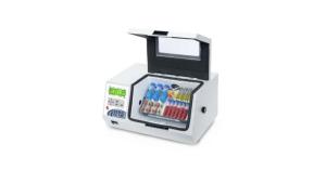 OHAUS Enviro-Genie e-MI3C benchtop refrigerated incubator with lid open, holding sample tubes and a flask