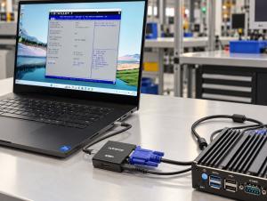 Laptop displaying an industrial PC BIOS screen through Cytrence Kiwi+ VGA, connected to an industrial computer via VGA and USB cables for direct system maintenance. Copy
