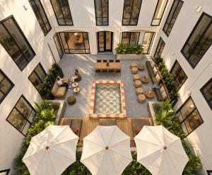 Vertical image of artists rendering of courtyard at 5077 College Avenue.
