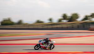 COMETS electric racing motorcycle on a race track during competition.