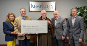 Kemp Klein Foundation presents a $30,000 contribution to Capuchin Soup Kitchen with Donna Kemp, Robert S. Zawideh, Brother Gary, John Kemp and Brian H. Rolfe.