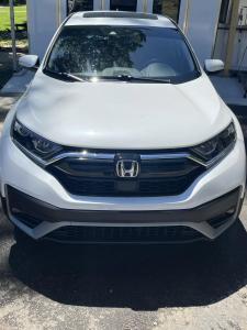 Front view of a white Honda CR-V after storm damage repair at SQR One Coll1sion in Cabot, Arkansas