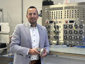 Markus Urich is seen holding a packaging product