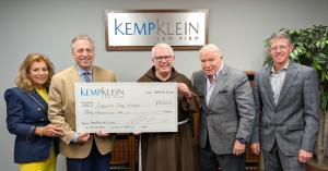 Kemp Klein Foundation presents a $30,000 contribution to Capuchin Soup Kitchen with Donna Kemp, Robert S. Zawideh, Brother Gary, John Kemp and Brian H. Rolfe.