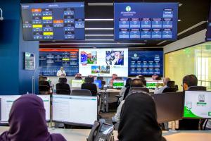 Staff monitoring live patient flow dashboards at the KFSH Command Centre