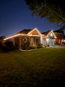 A professionally installed LED roofline display by All-In-One Pressure Washing Services LLC in League City, Texas.