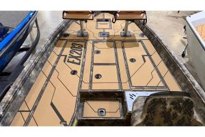 Deck view of Excel EX 203 aluminum boat showing storage hatches, pedestal seats and tan non-skid decking