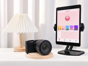 Panasonic LUMIX S9 full-frame mirrorless camera beside the ChackTok photo booth app on an iPad