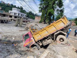 Truck stuck in mud post Nepal flash flooding