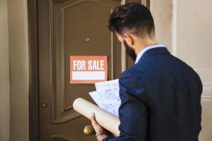 real-estate-agent-front-door-scaled -