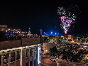 Fireworks light up the night sky above the rooftop of Hotel Goodwin in downtown Beloit, Wisconsin.