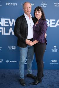 Director Traci L. Slatton in a purple embroidered jacket on the blue carpet at the 2026 Newport Beach Film Festival world premiere of HEROIC, her documentary about the creation of the National WWI Memorial.