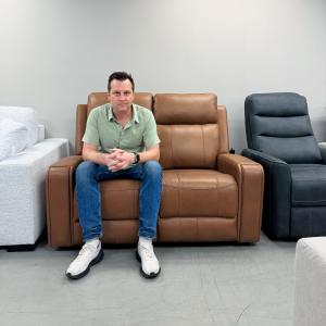 Sergei Tashlikowich Sitting on Cavron 58 Inch Leather Match Power Reclining 2 Seater Loveseat with Power Headrests
