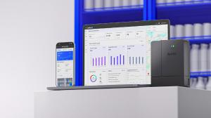 An image of the AoFrio iQ SaaS and SCS 800 cellular controller in front of a refrigerator with cold drinks.